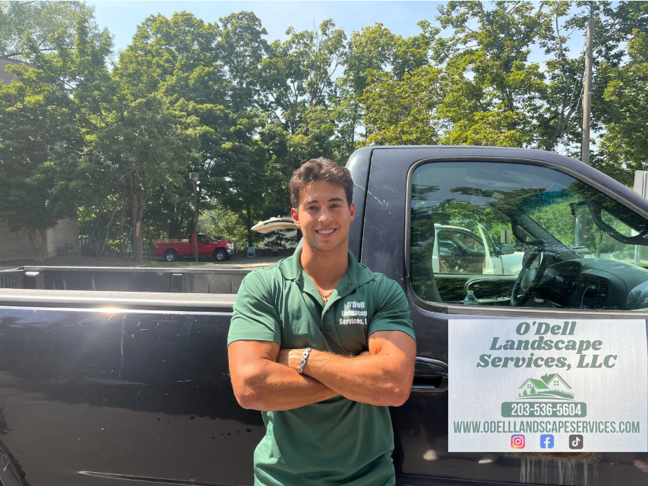 Garrett O'Dell of O'Dell Landscape Services with the company truck in Old Greenwich, Connecticut